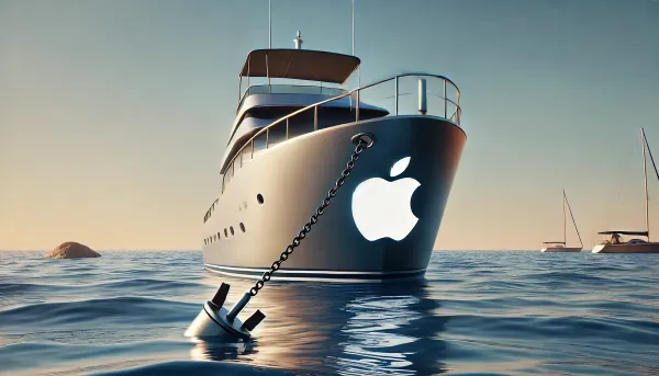 A boat with an Apple logo stuck on the front. The boat has an anchor dropped.